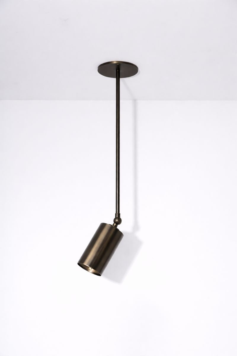 Modern pendant light with black and bronze design on a white background