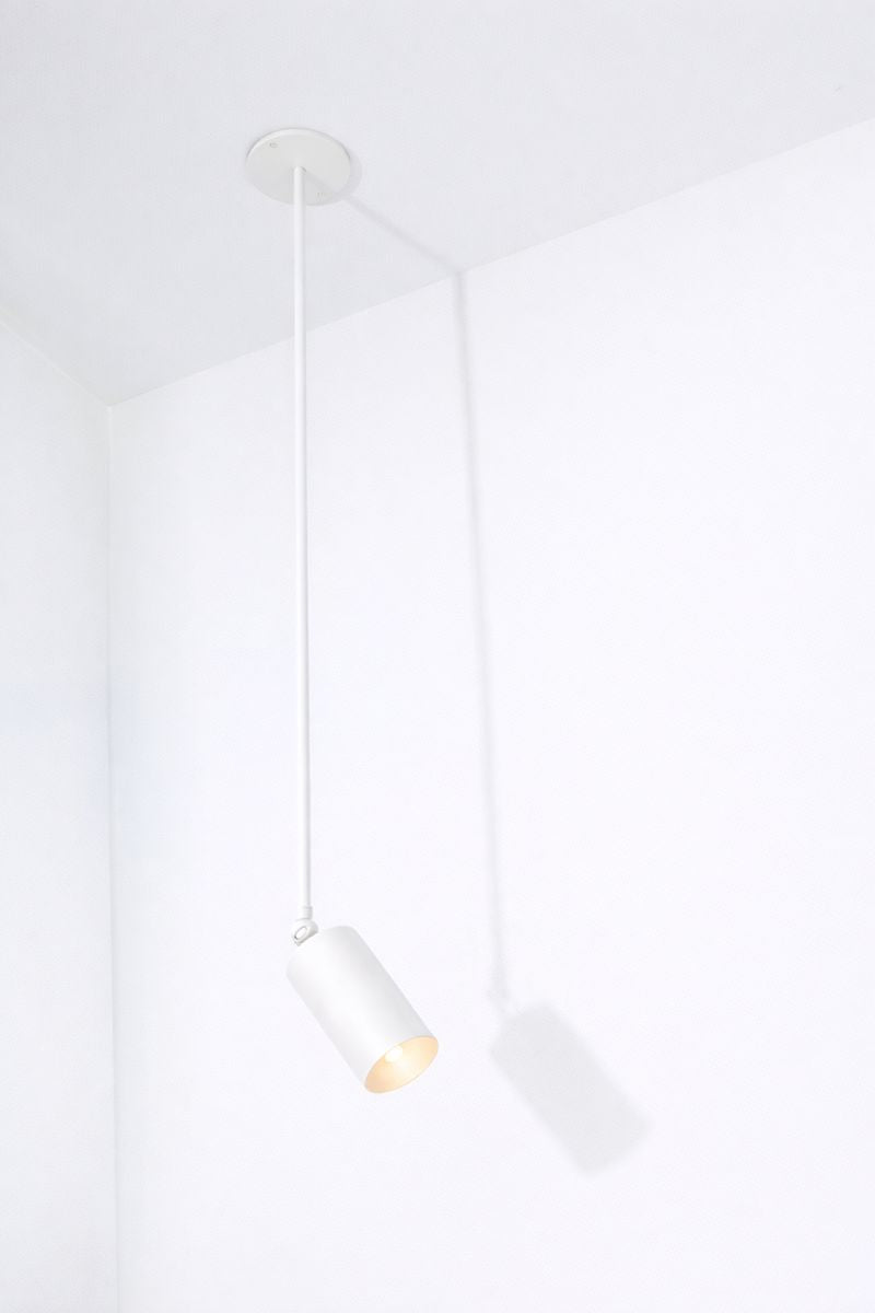 Modern white pendant light fixture on a white background